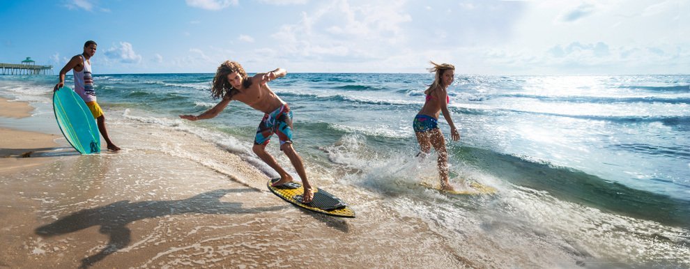skimboarders in action